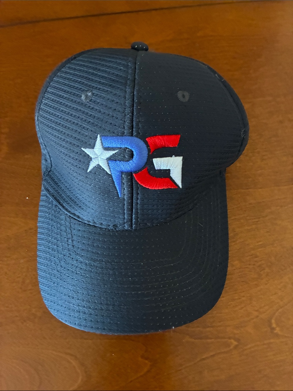 PG Black Baseball Cap with Red, White & Blue Logo